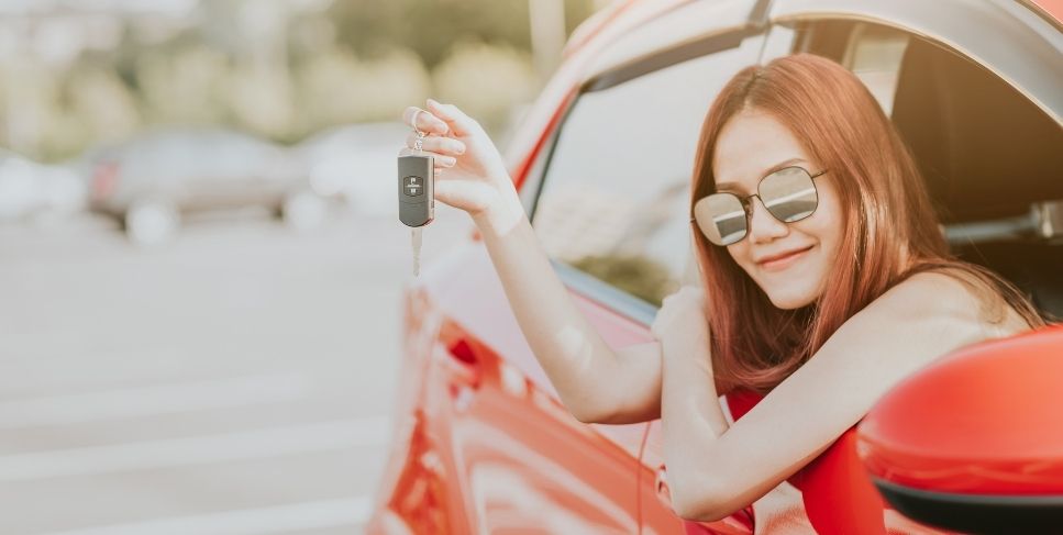 Lady holding new car keys