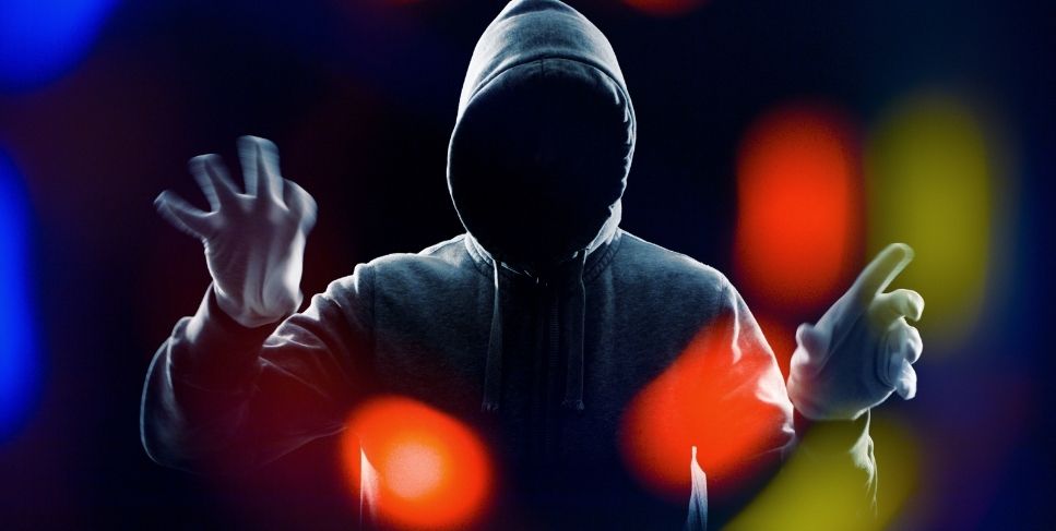 Faceless person in a dark hoodie