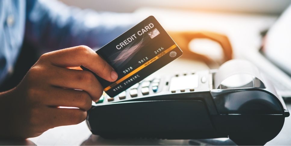 Person swiping a credit card