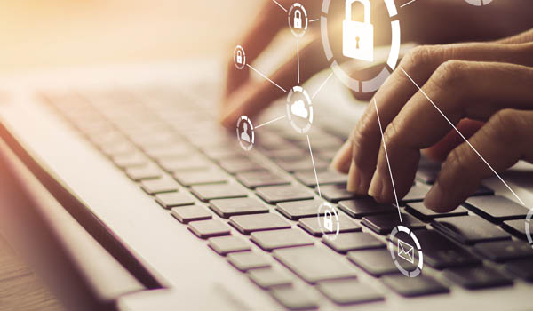 data_privacy Person typing on a laptop