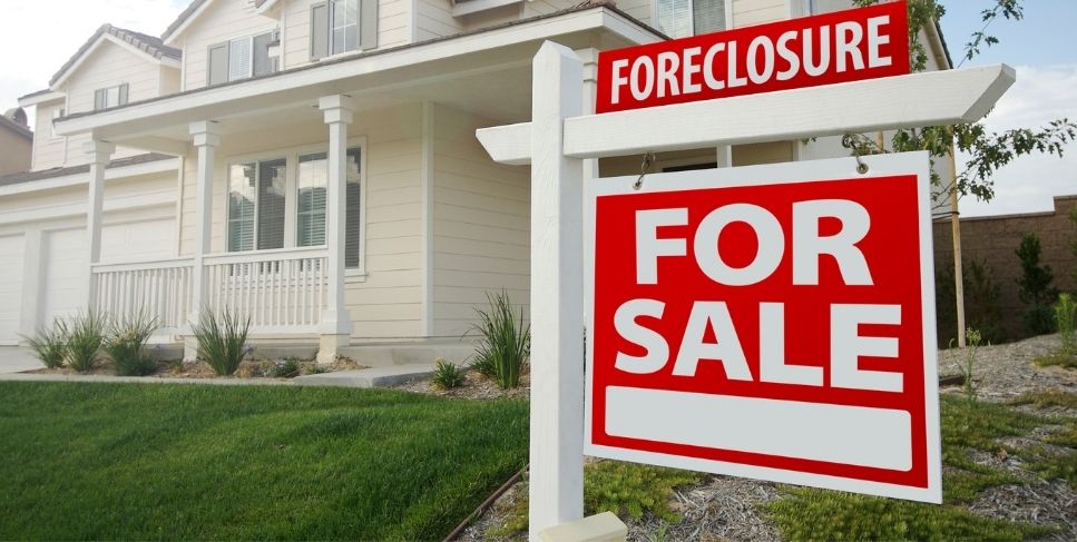 Foreclosure sign in front of a house
