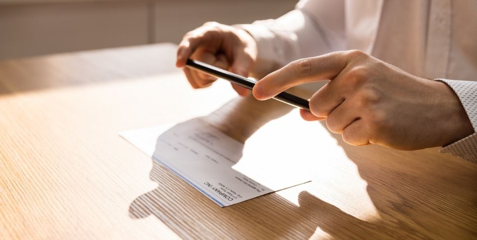 Person making a check deposit with their phone