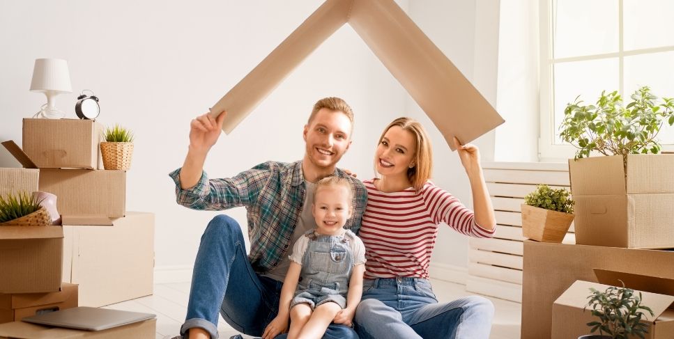 Family unpacking in new home