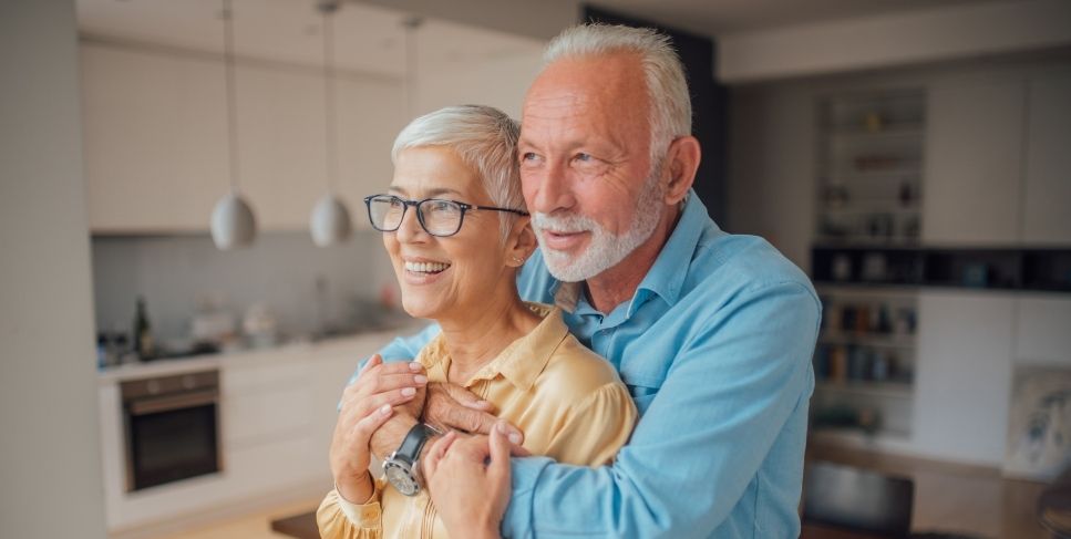 Couple in the kitchen smiling