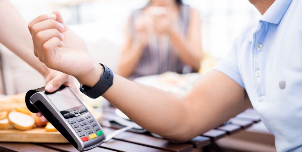 Person using contactless pay with watch